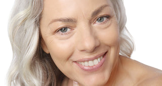 Woman with healthy glowing skin, smiling