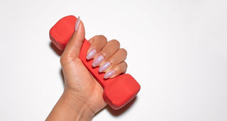 woman holding dumbell