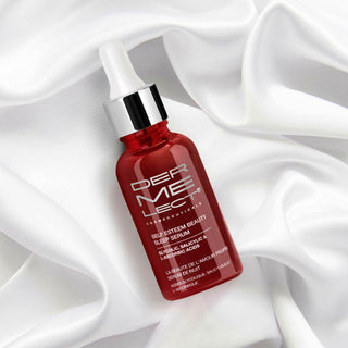 Red bottle of self-esteem beauty sleep serum on a bed sheet to show that it is a nighttime treatment.